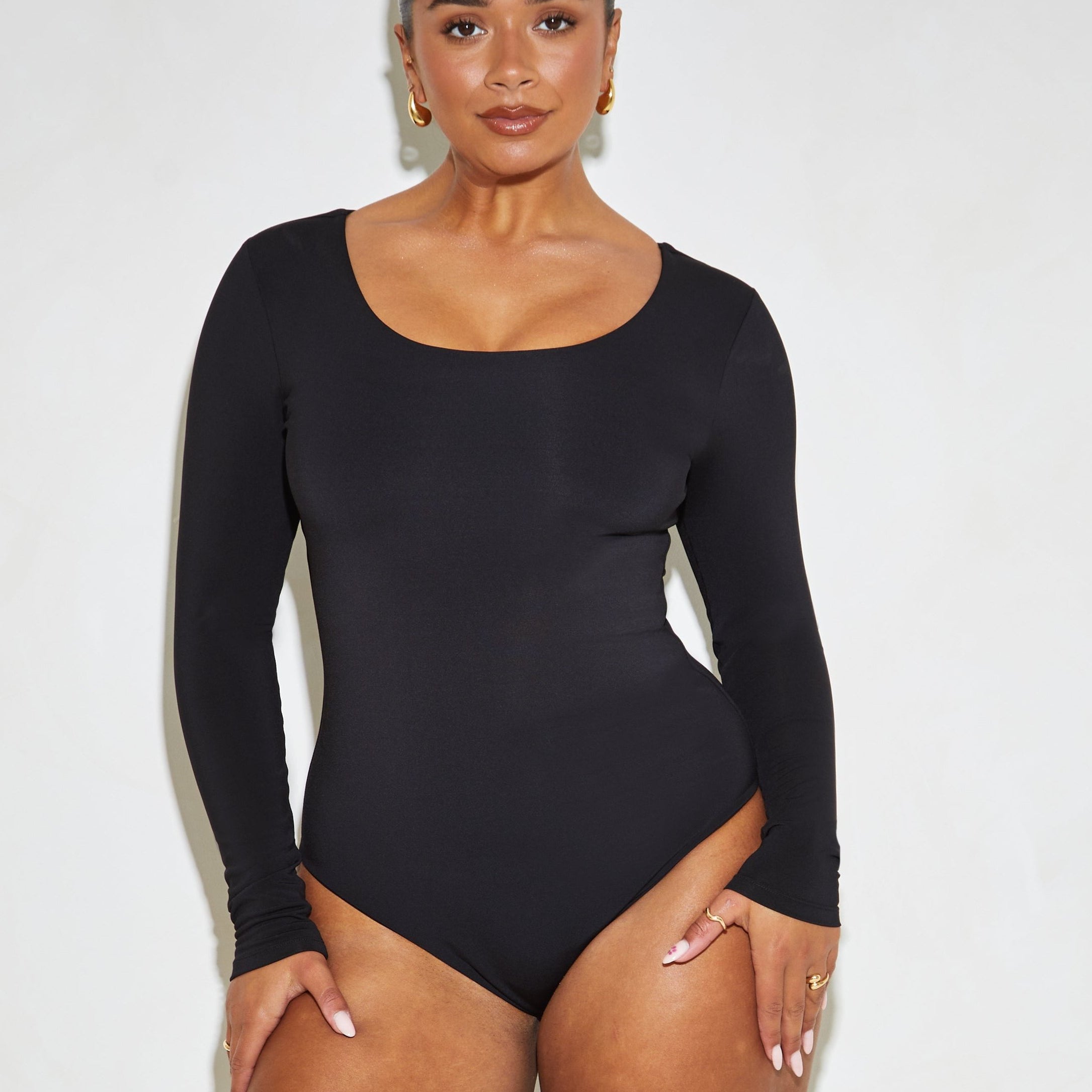 long sleeve scoop neck black bodysuit.